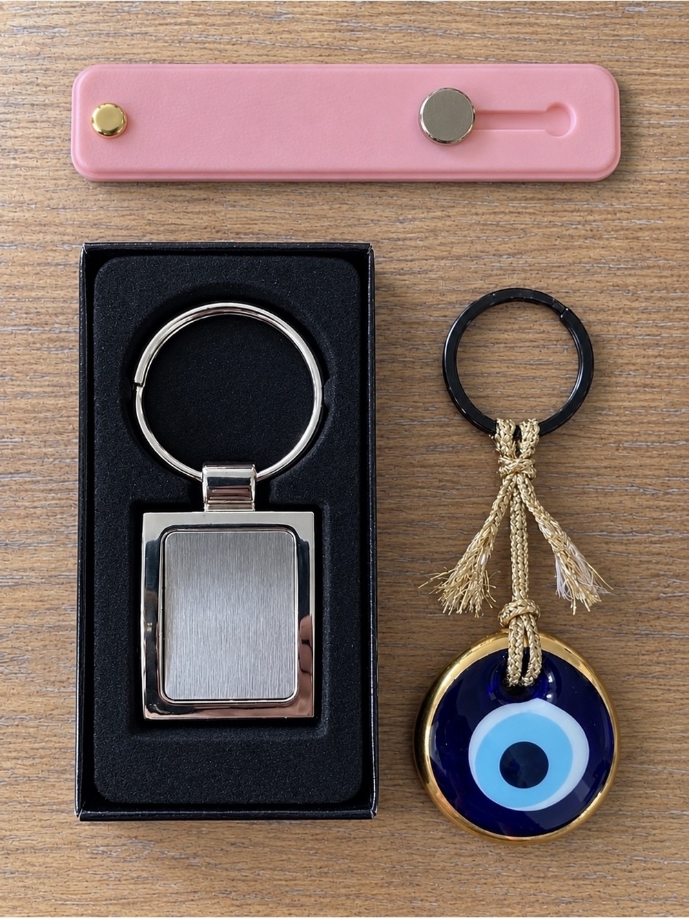 2 Unique Keychains + 1 pink phone kickstand
